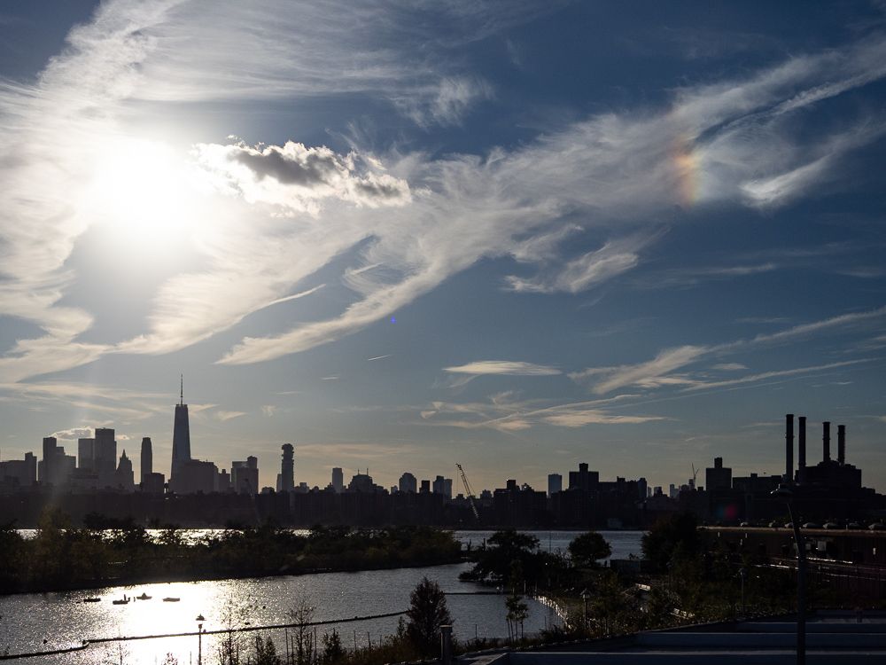 a sun dog over manhattan from a greenpoint rooftop