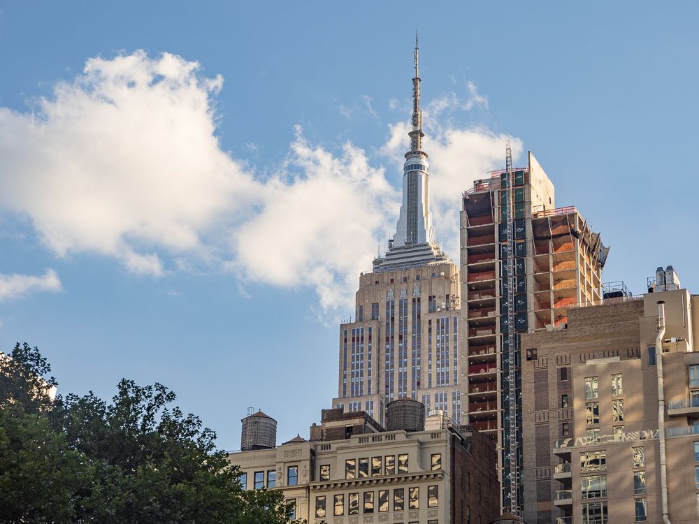 The Empire State Building merging with other buildings