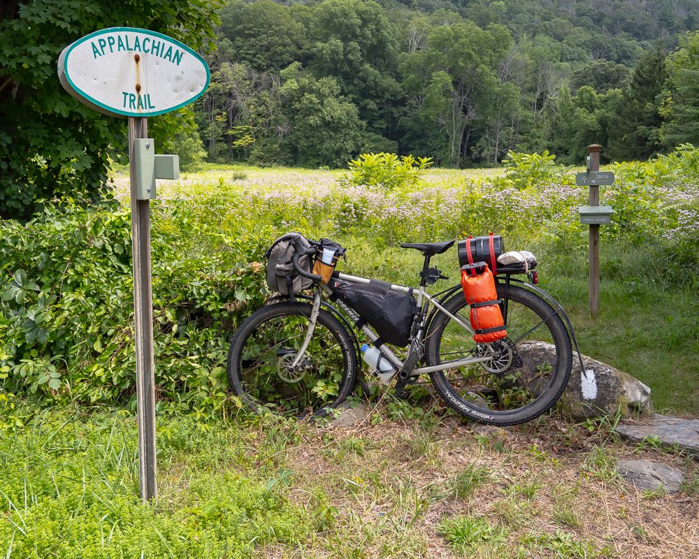My first glimpse of the Appalachian Trail. Note that the "AT" logo confusingly looks like an arrow in a context where arrows are often very important.